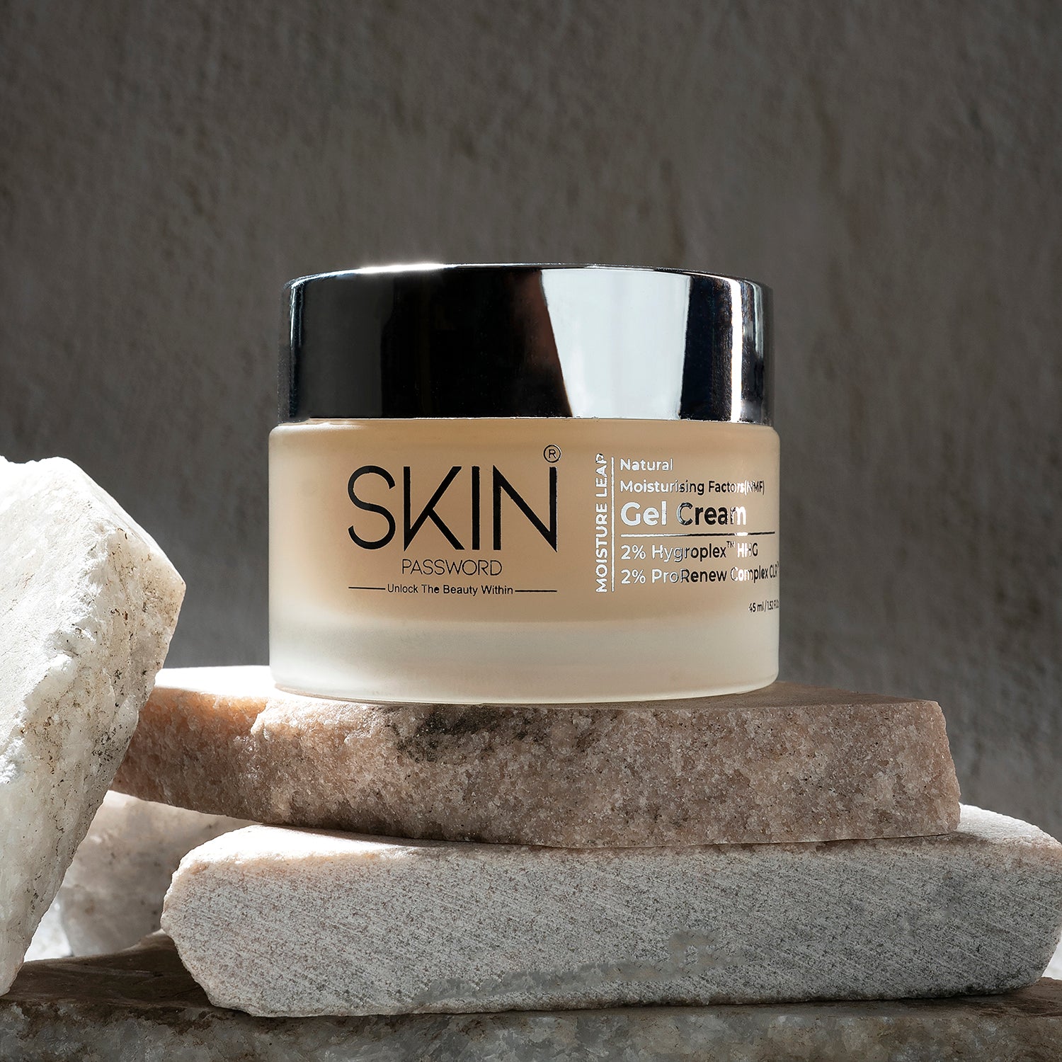 skinpassword moisture leap gel cream is displayed on natural stone slabs.